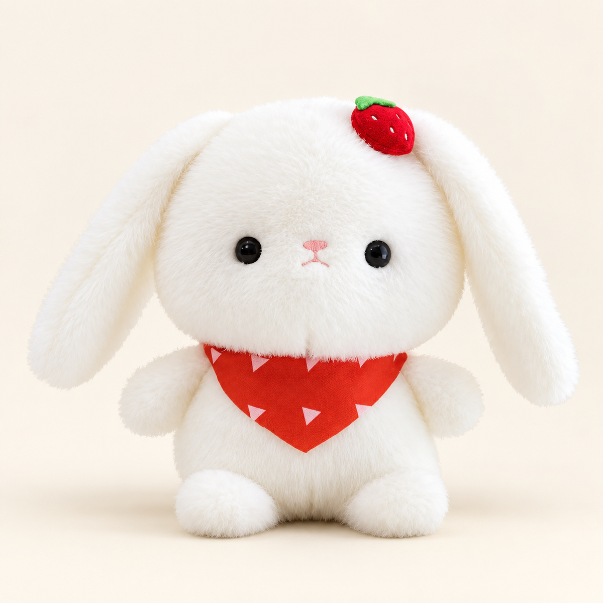 White floppy-ear rabbit plush with a red strawberry scarf and strawberry head detail